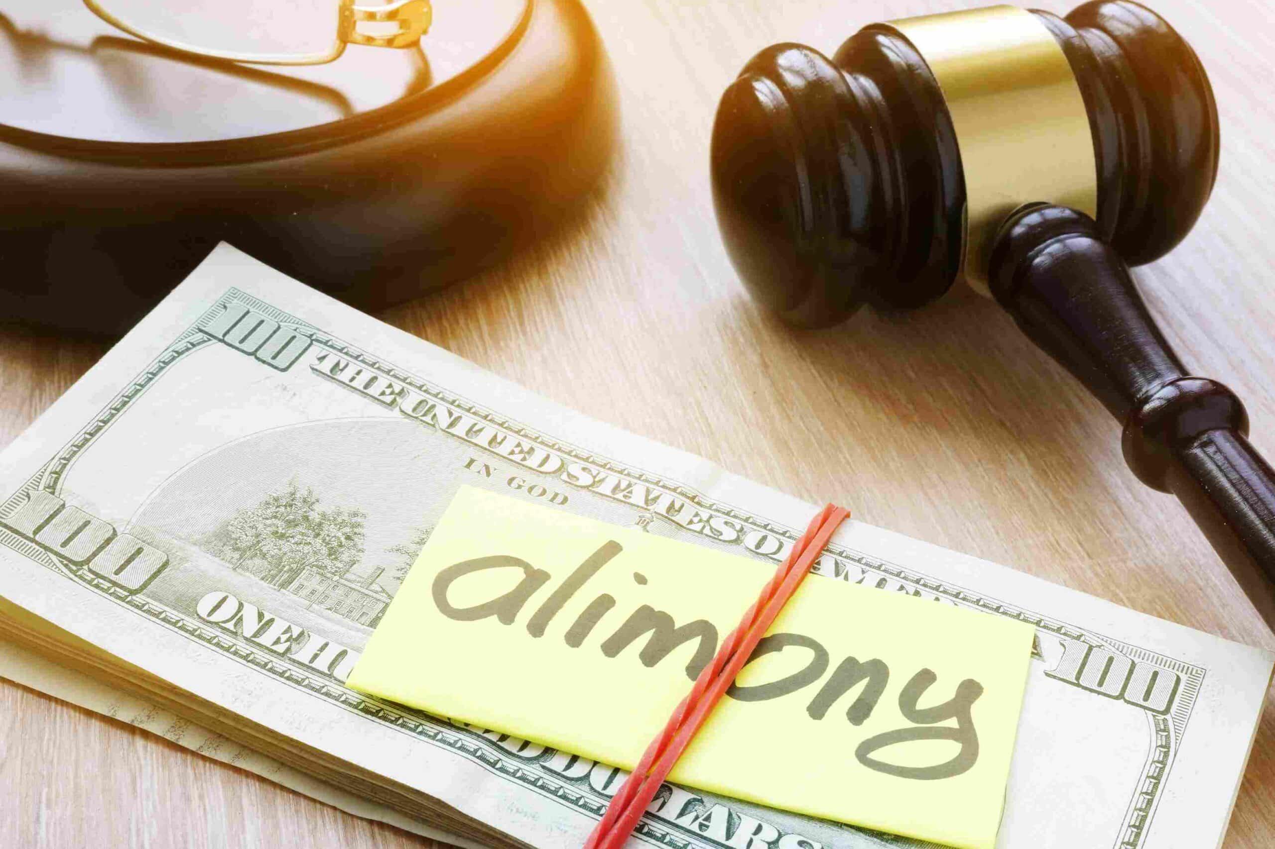 stack of cash and alimony note